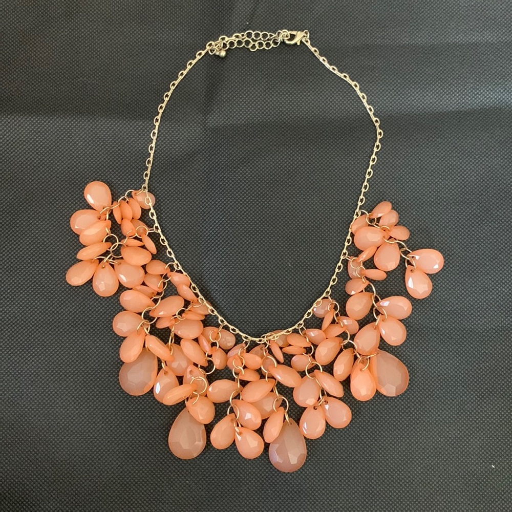 COPY - Faceted teardrop bib necklace with peach beads. Gold finish. Collar leng…